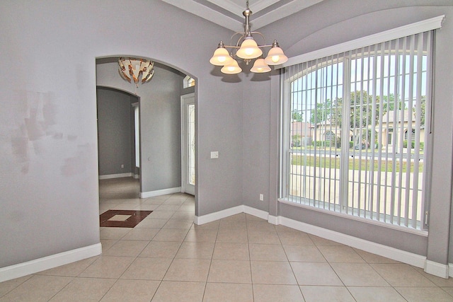 30 Fortress Pl, Palm Coast, FL 32137 - unfurnished dining area featuring a chandelier, arched walkways, healthy amount of natural light, and light tile patterned floors