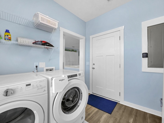 519 Arricola Ave, Saint Augustine, FL 32080 - laundry room featuring baseboards, electric panel, laundry area, independent washer and dryer, and wood finished floors