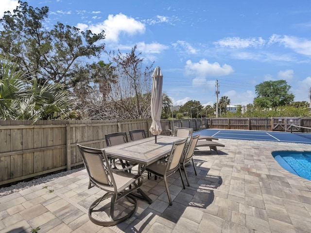 519 Arricola Ave, Saint Augustine, FL 32080 - view of patio with a fenced backyard, a fenced in pool, and outdoor dining area