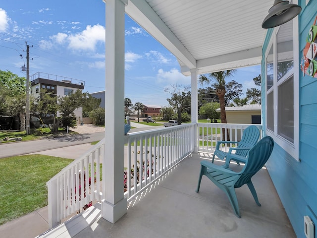 519 Arricola Ave, Saint Augustine, FL 32080 - balcony featuring a porch