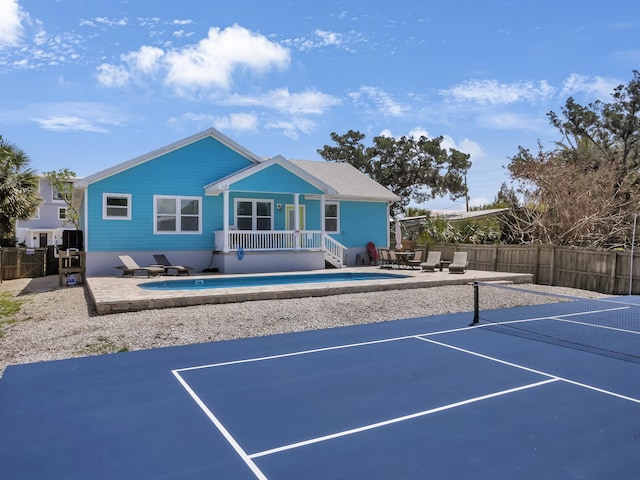 519 Arricola Ave, Saint Augustine, FL 32080 - view of tennis court with a patio area and fence