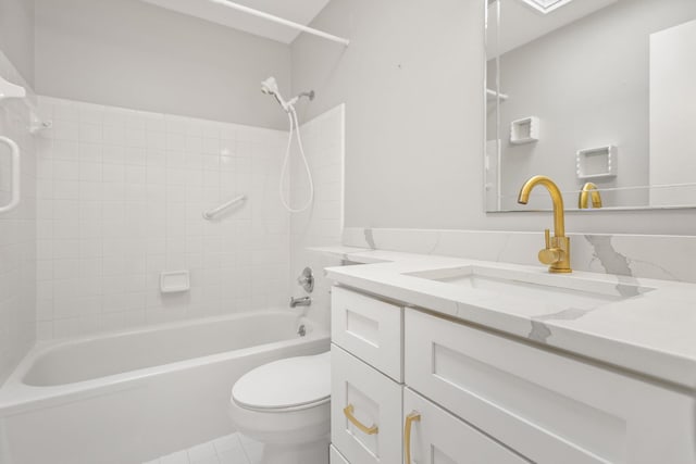 bathroom featuring toilet, tile patterned floors, tub / shower combination, and vanity