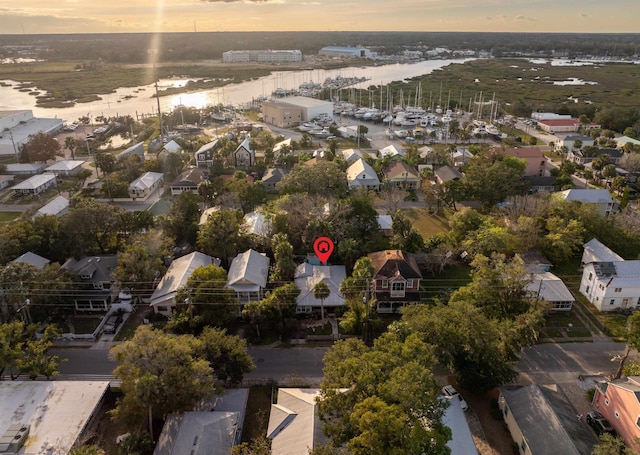 aerial view at dusk with a water view