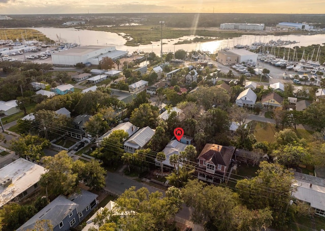 aerial view at dusk with a water view