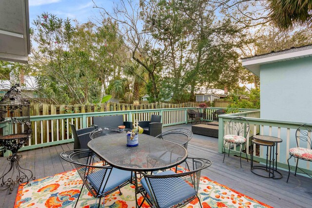 162 Martin Luther King Ave, Saint Augustine, FL 32084 - wooden deck with a fenced backyard and outdoor dining space