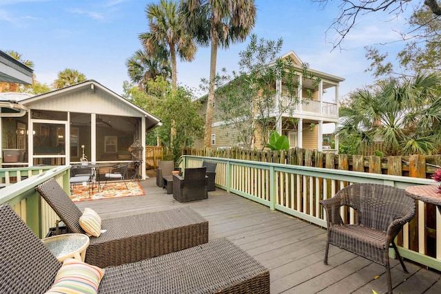 wooden terrace featuring a sunroom