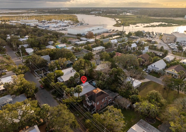 aerial view at dusk with a water view