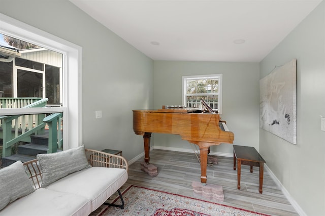 interior space featuring light hardwood / wood-style floors and vaulted ceiling