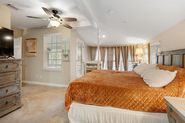 carpeted bedroom featuring a textured ceiling, ceiling fan, and vaulted ceiling