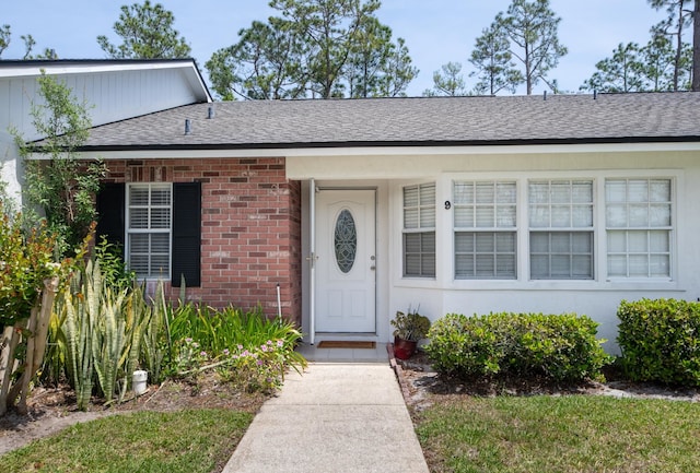 9 Kings Colony Ct Unit 9, Palm Coast, FL 32137 - entrance to property featuring brick siding and a shingled roof