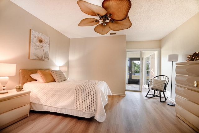 9 Kings Colony Ct Unit 9, Palm Coast, FL 32137 - bedroom with access to outside, wood finished floors, baseboards, and ceiling fan