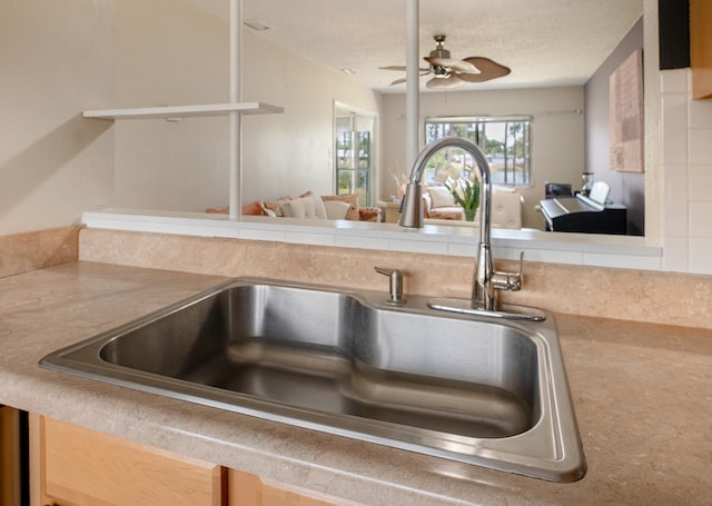 9 Kings Colony Ct Unit 9, Palm Coast, FL 32137 - kitchen view of a sink, a ceiling fan, and light countertops