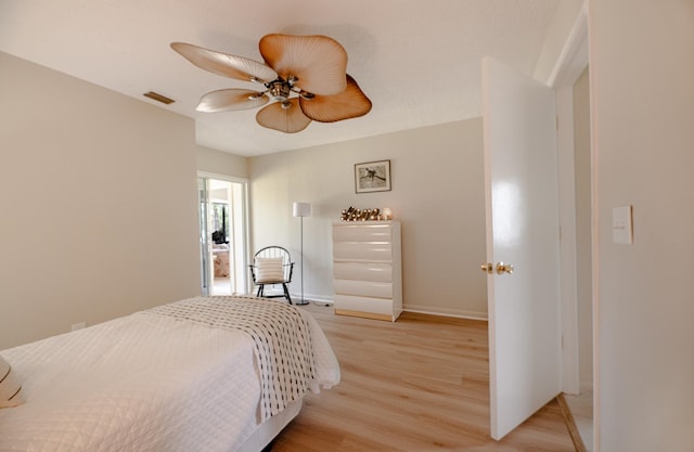 9 Kings Colony Ct Unit 9, Palm Coast, FL 32137 - bedroom with light wood-style flooring, baseboards, and a ceiling fan