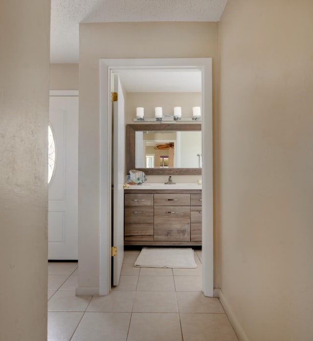 9 Kings Colony Ct Unit 9, Palm Coast, FL 32137 - corridor featuring light tile patterned floors and baseboards