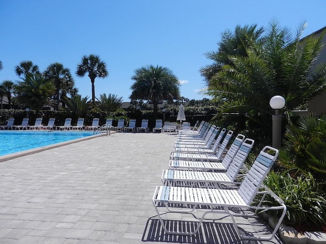 community pool with a patio