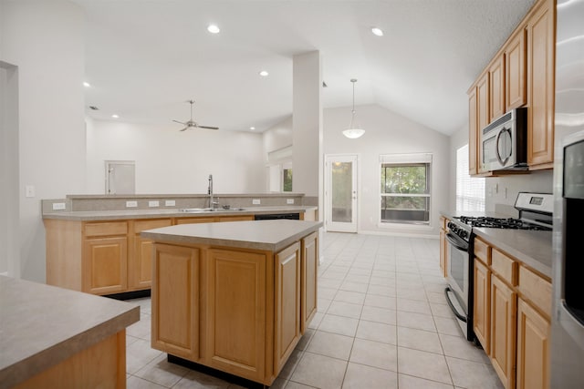 kitchen with sink, a center island, hanging light fixtures, lofted ceiling, and appliances with stainless steel finishes