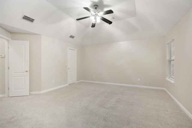 unfurnished room featuring light carpet and ceiling fan