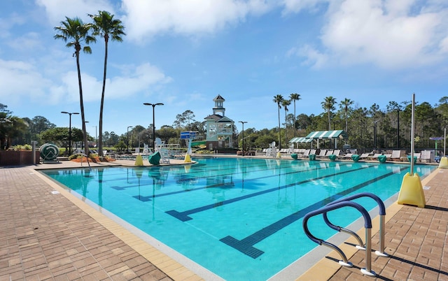 view of swimming pool with a patio