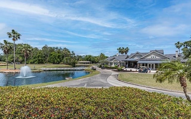 surrounding community featuring a water view