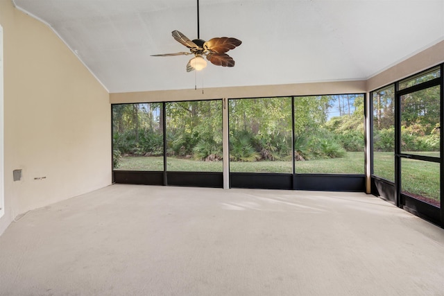 unfurnished sunroom with ceiling fan and vaulted ceiling