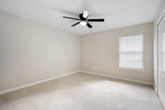 unfurnished room featuring carpet flooring and ceiling fan