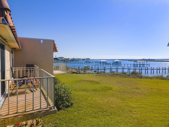 view of yard with a balcony and a water view