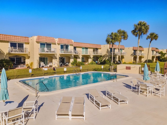 view of swimming pool with a patio area