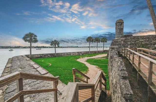 641 W Cathedral, Saint Augustine, FL 32084 - view of community with fence, a yard, and a water view