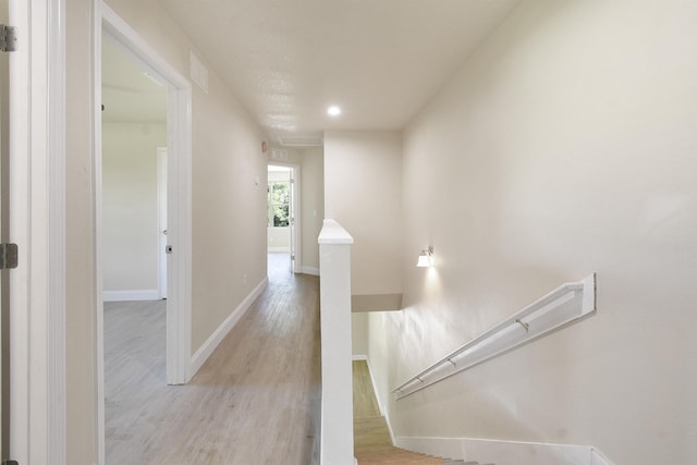 641 W Cathedral, Saint Augustine, FL 32084 - corridor with light wood finished floors, recessed lighting, an upstairs landing, visible vents, and baseboards