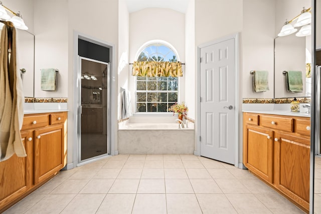 bathroom featuring vanity, tile patterned floors, and independent shower and bath