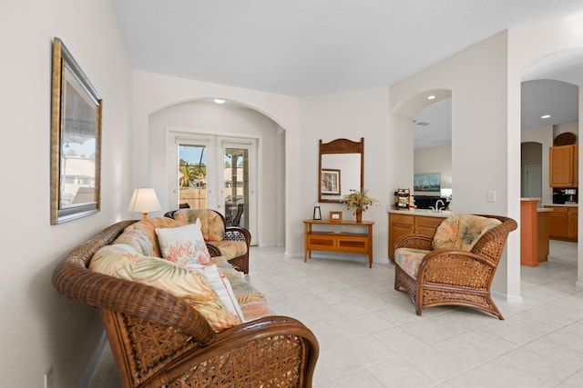 tiled living room with french doors