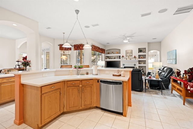 kitchen featuring built in shelves, light tile patterned flooring, sink, stainless steel dishwasher, and a kitchen island with sink