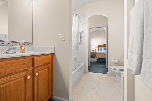 full bathroom featuring vanity, tile patterned flooring, toilet, and shower / bath combo with shower curtain