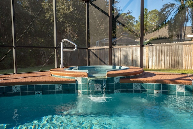 view of swimming pool featuring glass enclosure and an in ground hot tub