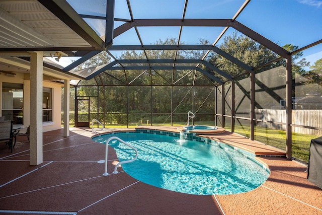 view of pool featuring an in ground hot tub, a lanai, and a patio