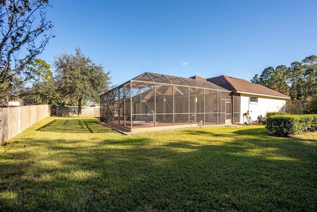 view of yard with a lanai