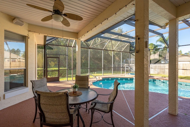 exterior space with a lanai, a patio area, and ceiling fan