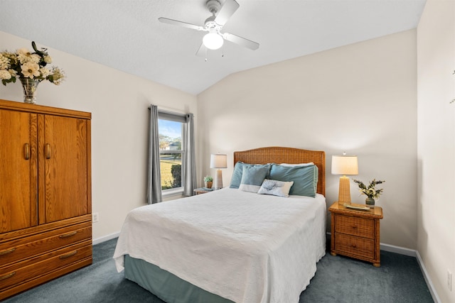 carpeted bedroom with vaulted ceiling and ceiling fan