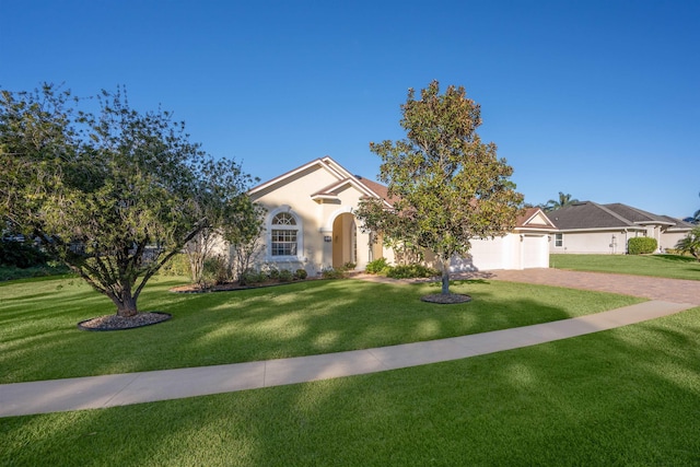 view of front facade featuring a garage and a front lawn