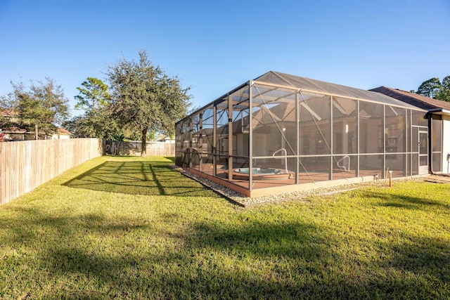 view of yard with glass enclosure