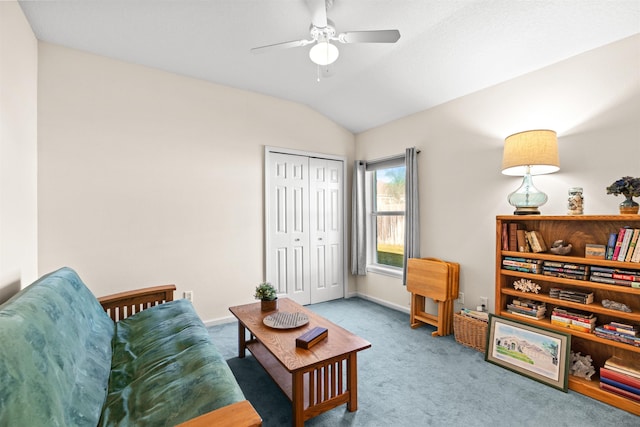 living area featuring ceiling fan, vaulted ceiling, and carpet