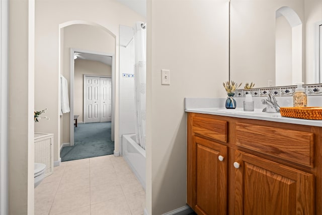 full bathroom featuring tile patterned flooring, vanity, shower / tub combo, and toilet