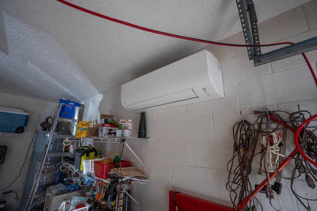 garage featuring a wall mounted AC