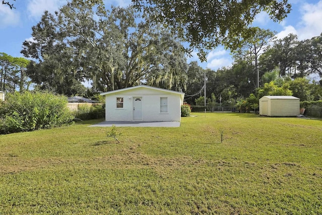 view of yard with a patio area and a shed