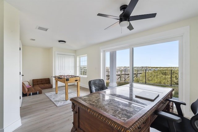 office space featuring light hardwood / wood-style floors and ceiling fan