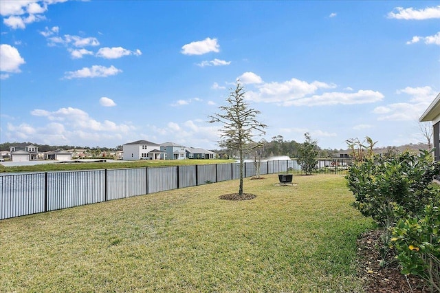 view of yard with fence and a residential view