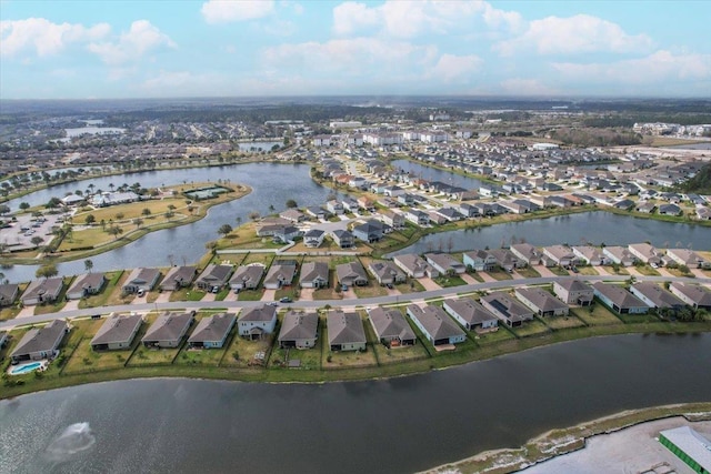 birds eye view of property with a residential view and a water view