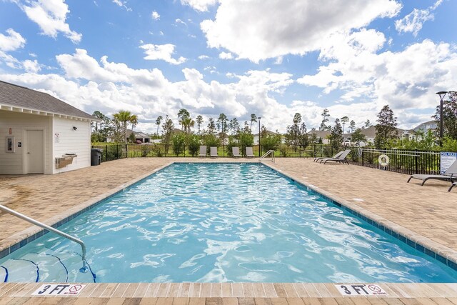 135 Sunstone Ct, Saint Augustine, FL 32086 - community pool featuring a patio area