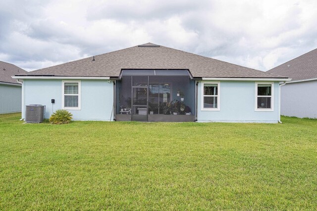135 Sunstone Ct, Saint Augustine, FL 32086 - rear view of house with roof with shingles, a yard, and central AC