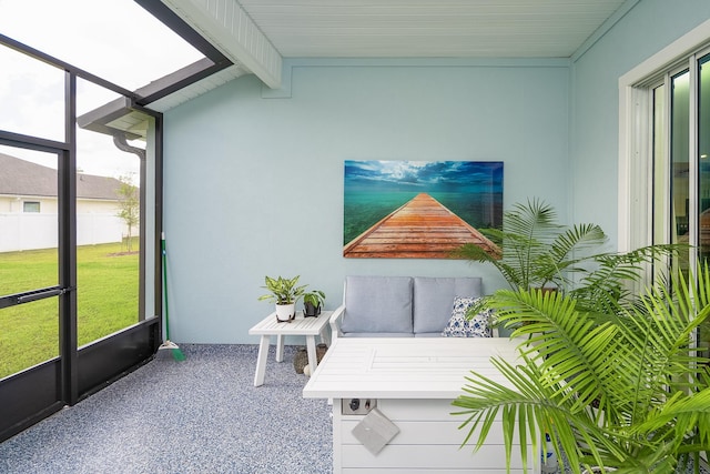 sunroom with lofted ceiling with beams